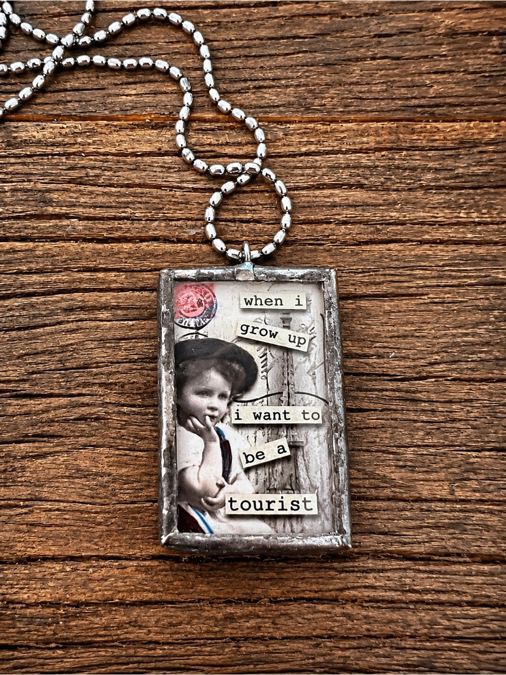 Vintage Style 'When I Grow Up I Want To Be A Tourist' Collage Pendant Necklace
